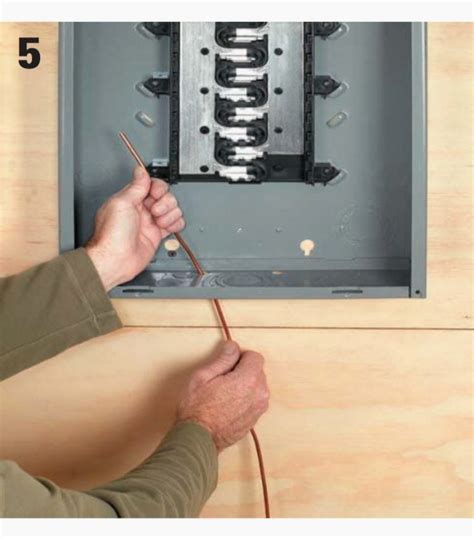 hooking the ground to an electrical box|installing copper ground wire on panel box.